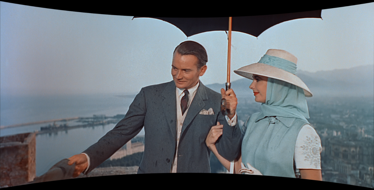 Screen capture of Denholm Elliot and Elizabeth Taylor near the end of "Scent of Mystery."