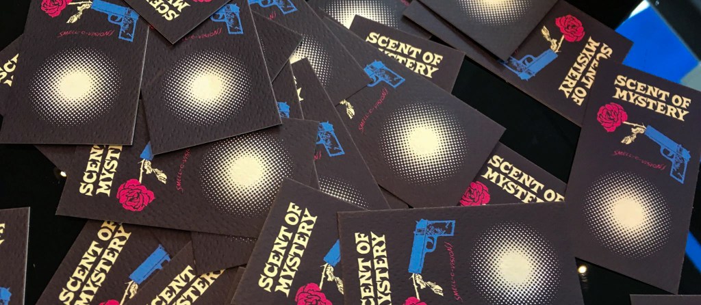 A stack of "Scent of Mystery" cards for audiences to smell the stand in fragrance for the titular perfume.